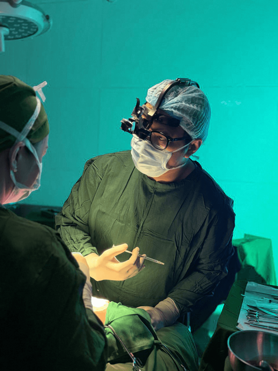 Surgeon performing procedure